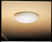 Kichler white dome flush-mount light installed directly against a ceiling