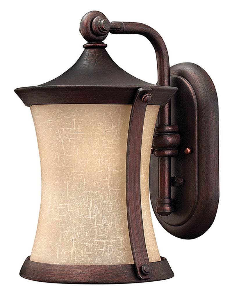 Hinkley Thistledown wall lantern with pale textured panels, curved bronze straps and a sloped roof