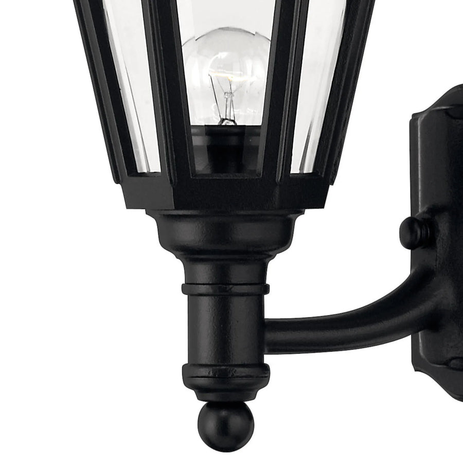 Close view of Manor House 1419BK clear glass, black lower collar, curved arm and wall plate