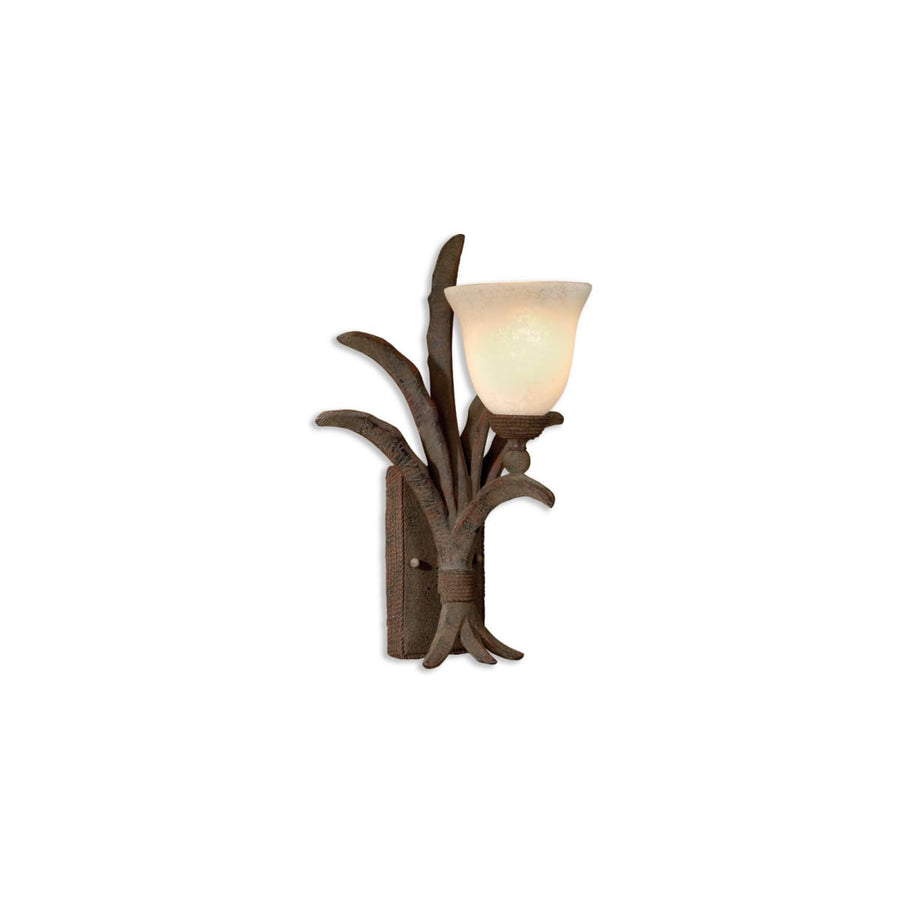 Uttermost Leena sconce with a warm pale cup shade among rustic brown leaf-like accents
