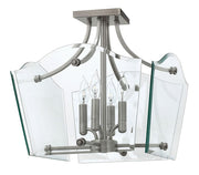 Hinkley Wingate fixture with four candle-style lights, clear curved panels and polished metal framing