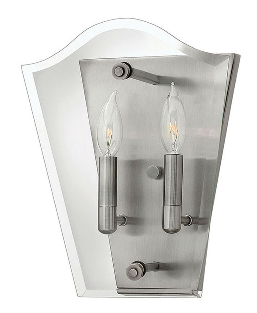 Hinkley Wingate wall sconce with two candle-style lights, clear curved panels and a polished metal backplate