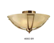 Hinkley Bolla ceiling light with an amber-toned bowl, curved bronze supports and rounded finial