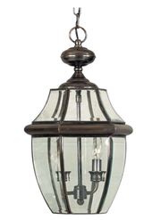 Quoizel Newbury Aged Copper hanging lantern with clear glass and two candle lights