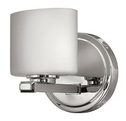 Angled view of Hinkley Ocho chrome bath sconce with an etched-opal shade and round backplate