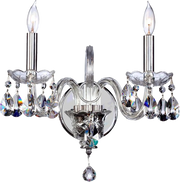 Traditional two-arm wall sconce with curved clear-looking arms, candle lamps and hanging faceted drops.