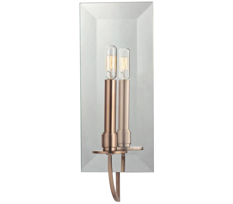 Hudson Valley Somers brushed-bronze candle sconce and its reflection in a tall beveled mirror