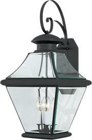 Quoizel Rutledge RJ8414K outdoor wall lantern with a black scroll bracket and clear faceted panels