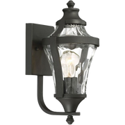 Libre wall lantern with textured clear panels and a curved lower support