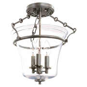 Hudson Valley Eaton semi-flush light with a clear bell shade and three candle lights