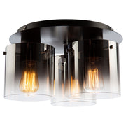 Low-angle view of Artcraft Henley black flush mount with three smoke-fade glass cylinders and exposed bulbs