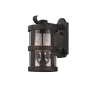 Troy Lighting Barbosa wall lantern with a cylindrical clear enclosure, textured bands and a curled accent