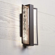 Angled installed view of George Kovacs Sidelight P1207-615B-L showing rippled glass and a bronze frame