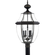 Quoizel Newbury NY9045Z post lantern in Medici Bronze with curved clear glass and an urn-like finial