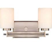 Quoizel Taylor TY8602AN vanity light with two white cylindrical shades and an Antique Nickel double rail