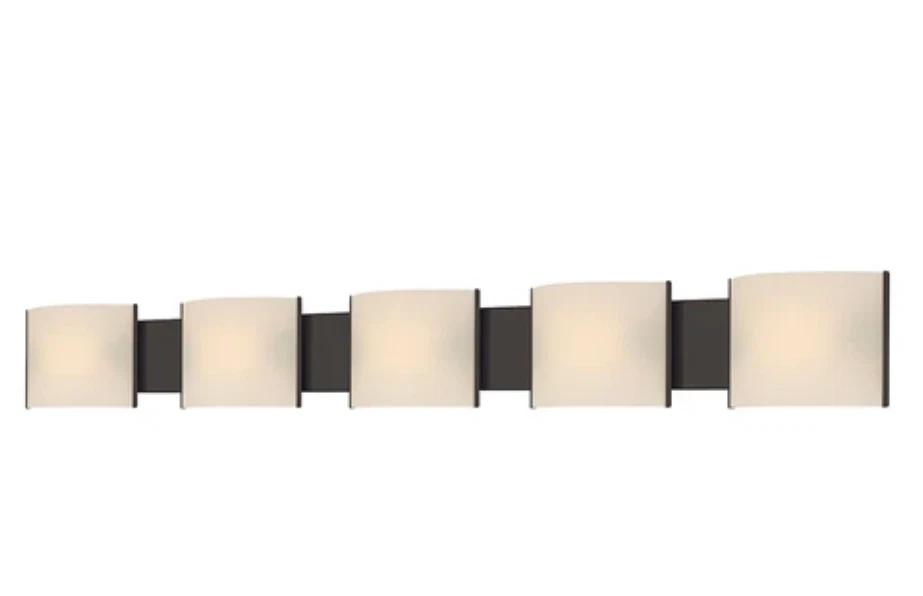 Micro-Pannelli vanity light with five pale curved rectangular shades across a dark bronze horizontal backplate.