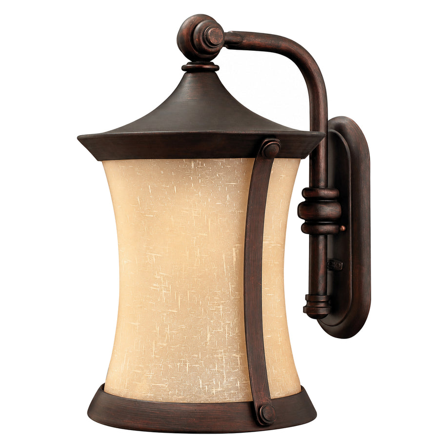Hinkley Thistledown bronze wall lantern with an amber textured shade and curved bracket