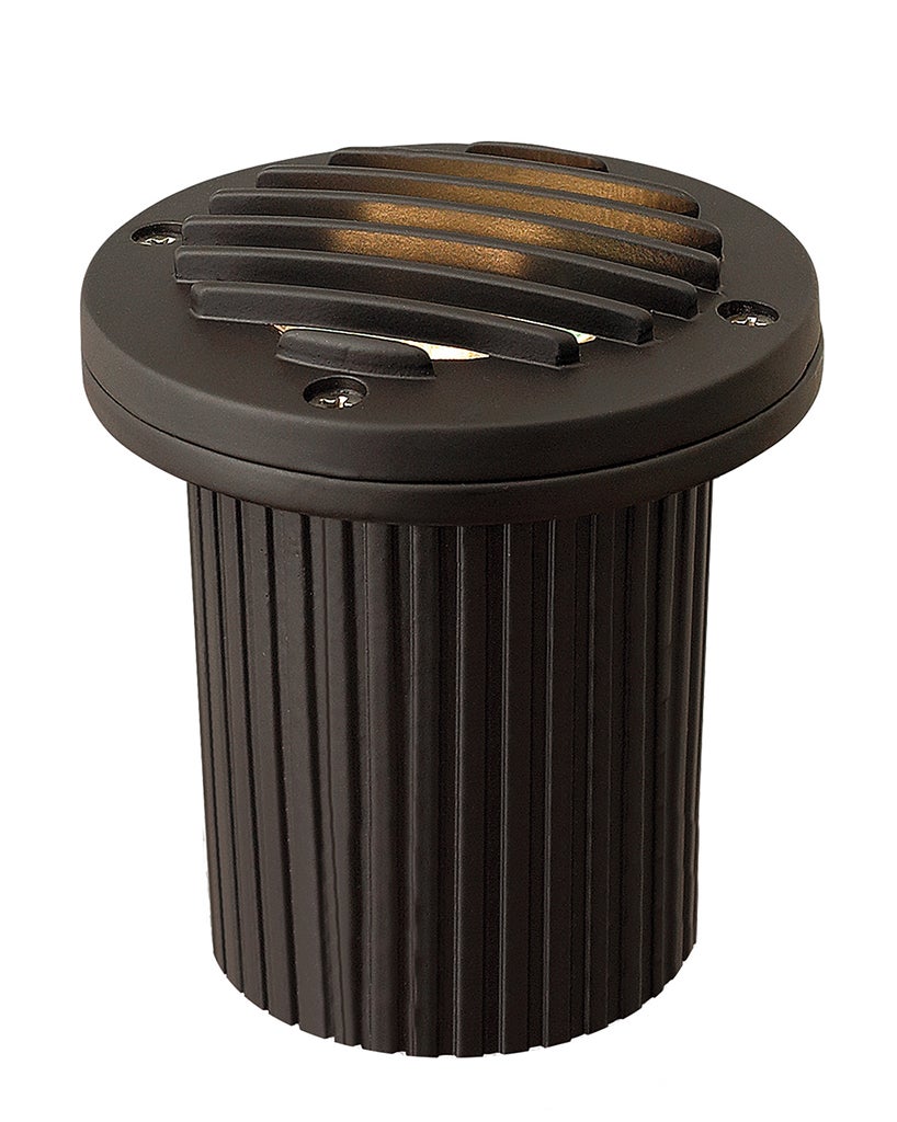 Bronze-toned in-ground well-light housing with a ribbed cylinder, louvered round top and visible screws.