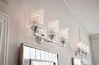 Hinkley 5043BN three-light Brushed Nickel vanity light shown in an interior setting