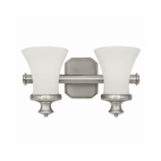 Hinkley Amherst brushed nickel vanity light with two flared white shades and a clipped-corner backplate.