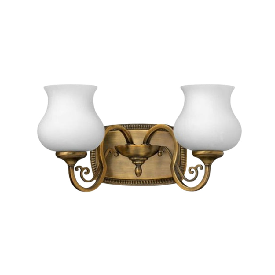 Close view of the Hinkley Olivia bronze vanity light and its traditional scroll detailing.