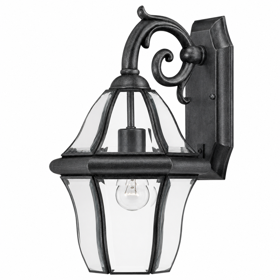 Mt. Vernon dark-finish outdoor wall lantern with a curled bracket and clear bowed panels around one visible bulb.