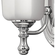 Hinkley Shelly sconce detail showing its chrome cup, turned collar and pointed finial