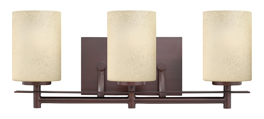 Hinkley Stowe Metro Copper vanity with three mottled cream glass shades and a rectangular backplate.