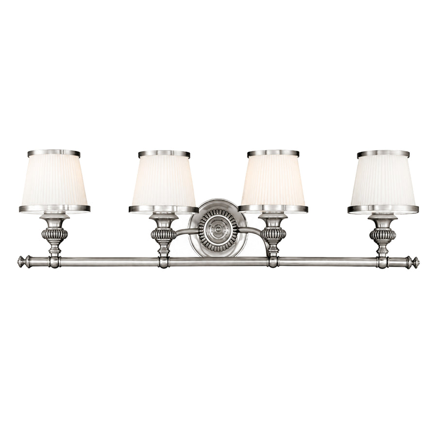 Hudson Valley Milton 2004-PN vanity light with four white shades, fluted holders and an ornate round nickel plate