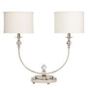 Kichler Andre 70751 lamp with two off-white drum shades, clear spherical accents and a polished nickel twin-arm frame.