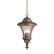 Kichler 9897TZG three-light chain-hung lantern in Tannery Bronze with Gold Accent