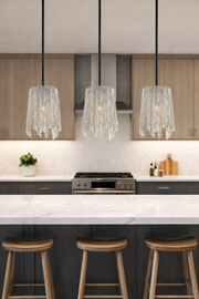 Three separate Kichler draped-shade pendants above a kitchen island