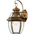 Quoizel Newbury outdoor wall lantern with a compact solid brass frame and clear glass panels