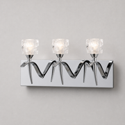 Mantra Viena chrome wall light with clear faceted shades across a long mirrored backplate