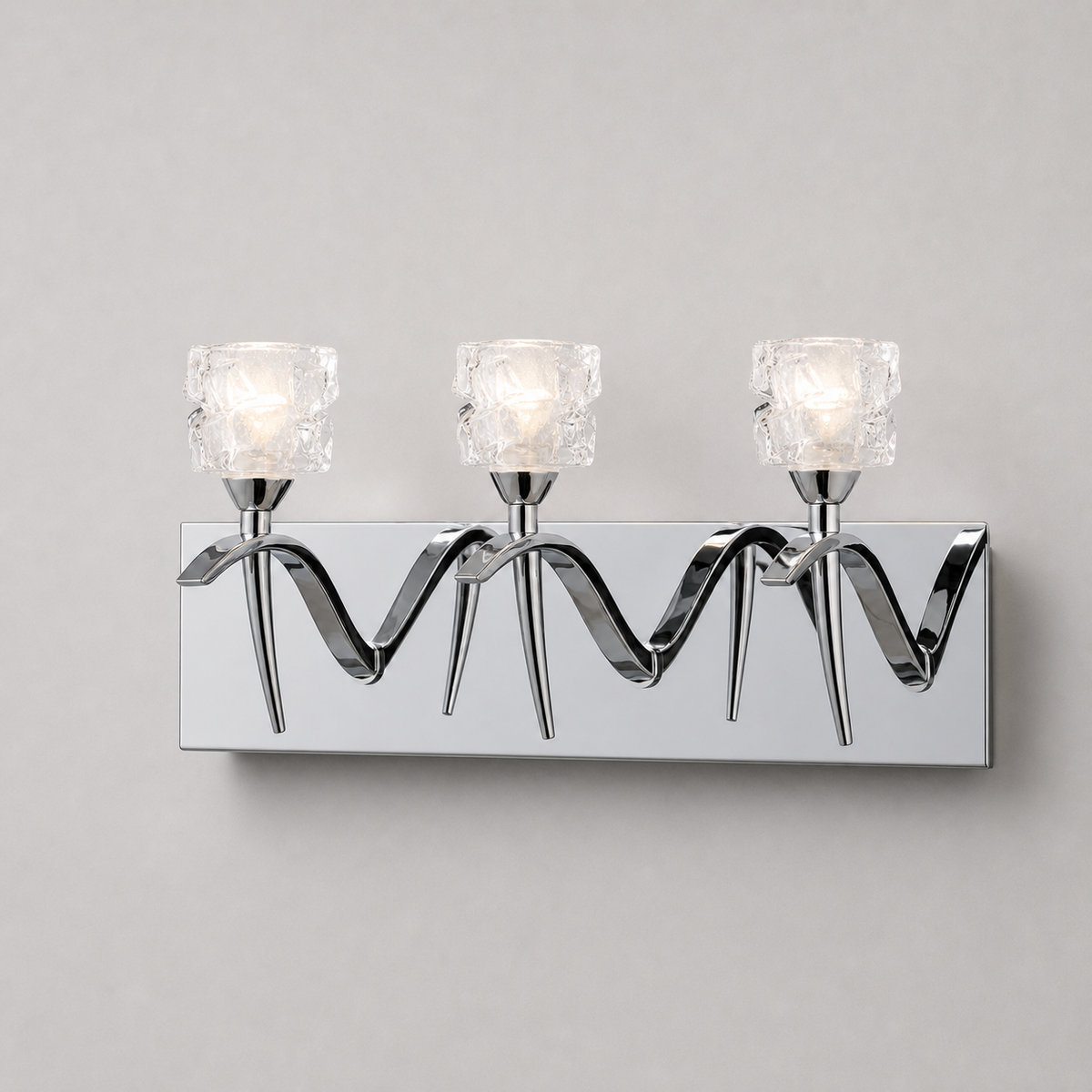 Mantra Viena chrome wall light with clear faceted shades across a long mirrored backplate