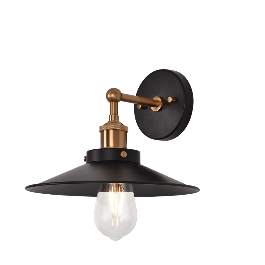 Industrial wall sconce with a broad black shade, warm brass-tone arm and one exposed clear bulb.