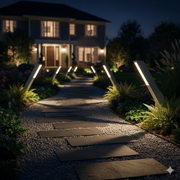 Piza low voltage LED path light staked in a planted garden bed