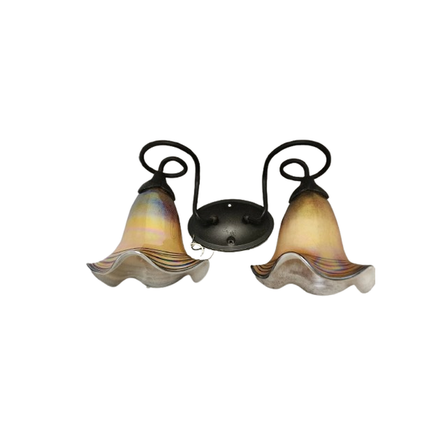 Quoizel Todd Phillips art-glass sconce showing warm amber shades and a flowing bronze-toned frame