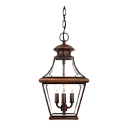Quoizel Carleton CAR1801AC hanging lantern with Aged Copper framing, clear beveled glass and three candle-style lamps.