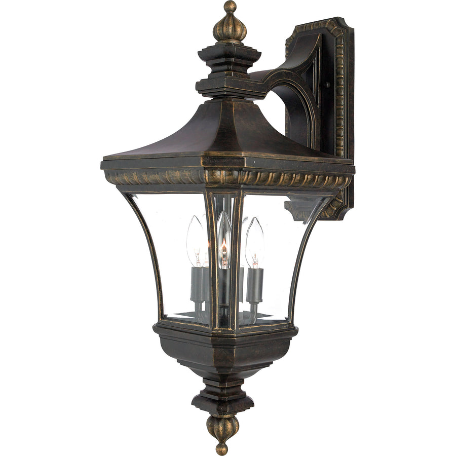 Quoizel Devon wall lantern showing curved clear panels and decorative finials