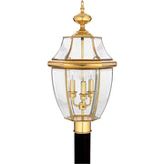 Quoizel Newbury NY9043B three-light outdoor post lantern in polished brass with clear beveled glass