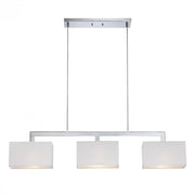 Quoizel Remi island pendant with three rectangular white shades and a linear chrome frame.