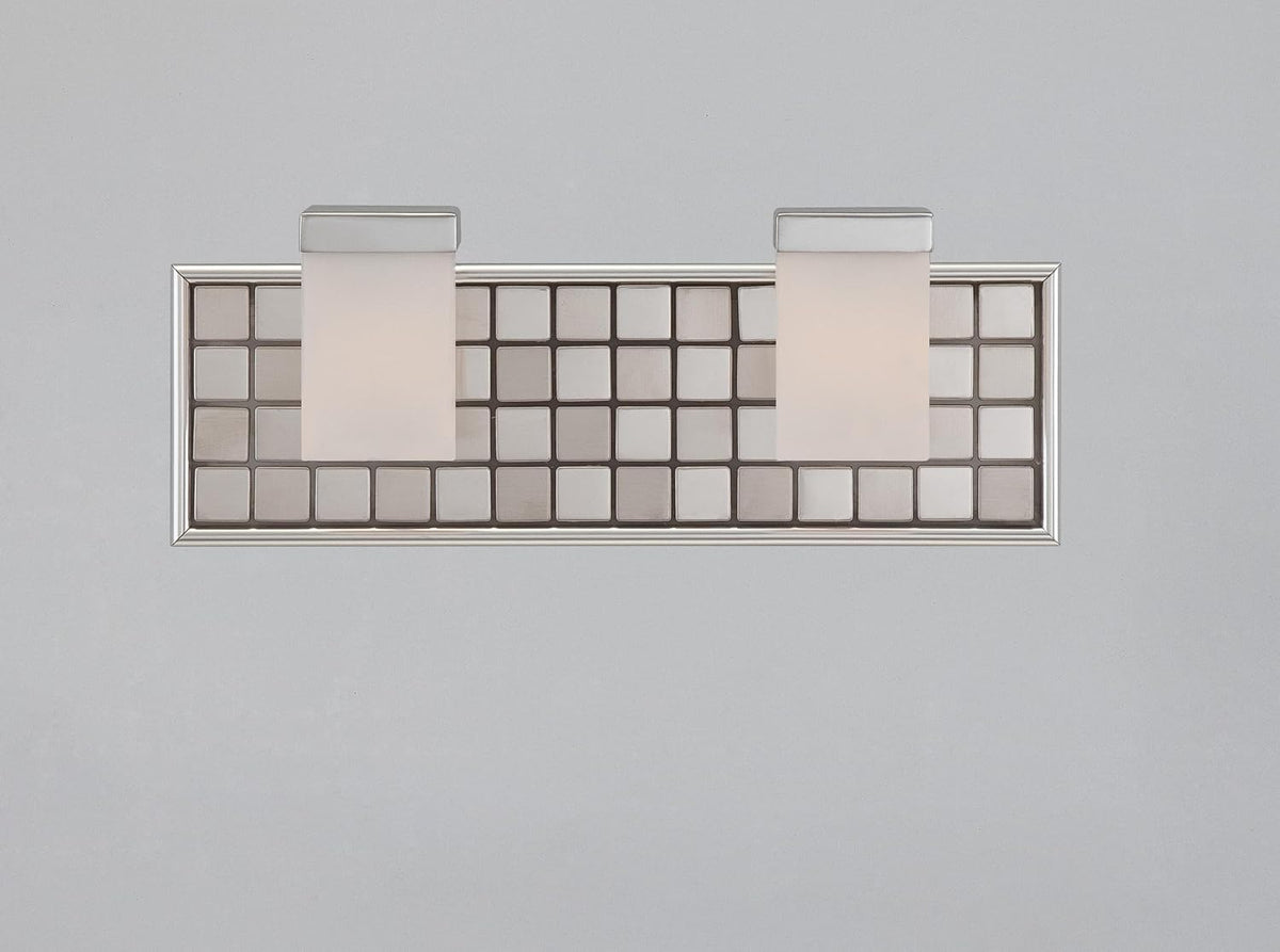 Front view of Quoizel Vetreo Metallica two-shade vanity and its framed square-tile backplate.
