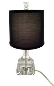Robert Abbey Brigette table lamp with a black drum shade and clear faceted base