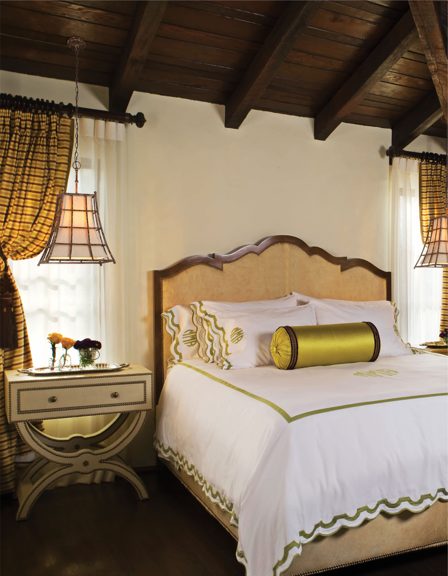 Left Bank lattice pendants beside a bed in a room with a timber ceiling