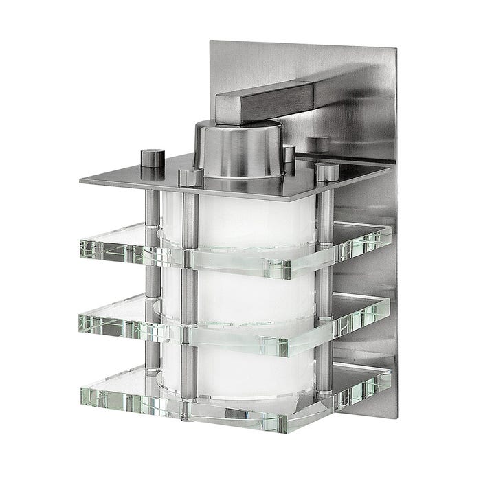 Fredrick Ramond Luxe wall sconce with stepped clear-glass tiers and a white cylindrical shade